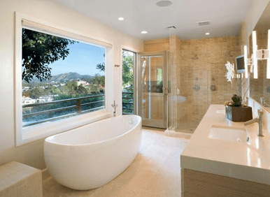 Spacious bathroom with glass shower enclosure