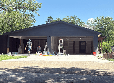 Residential painting project with tools and ladder