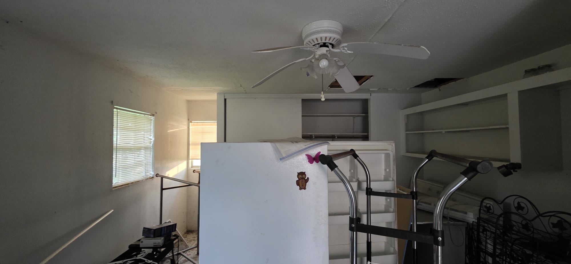 Photography studio setup with lighting equipment and a white backdrop.