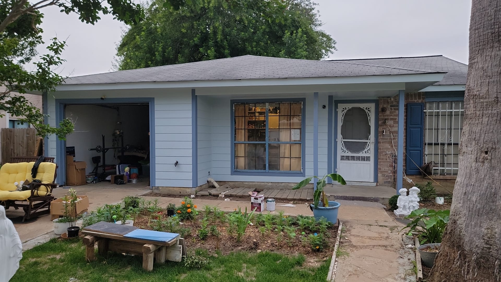 Cozy single-story house with a garden and front porch.
