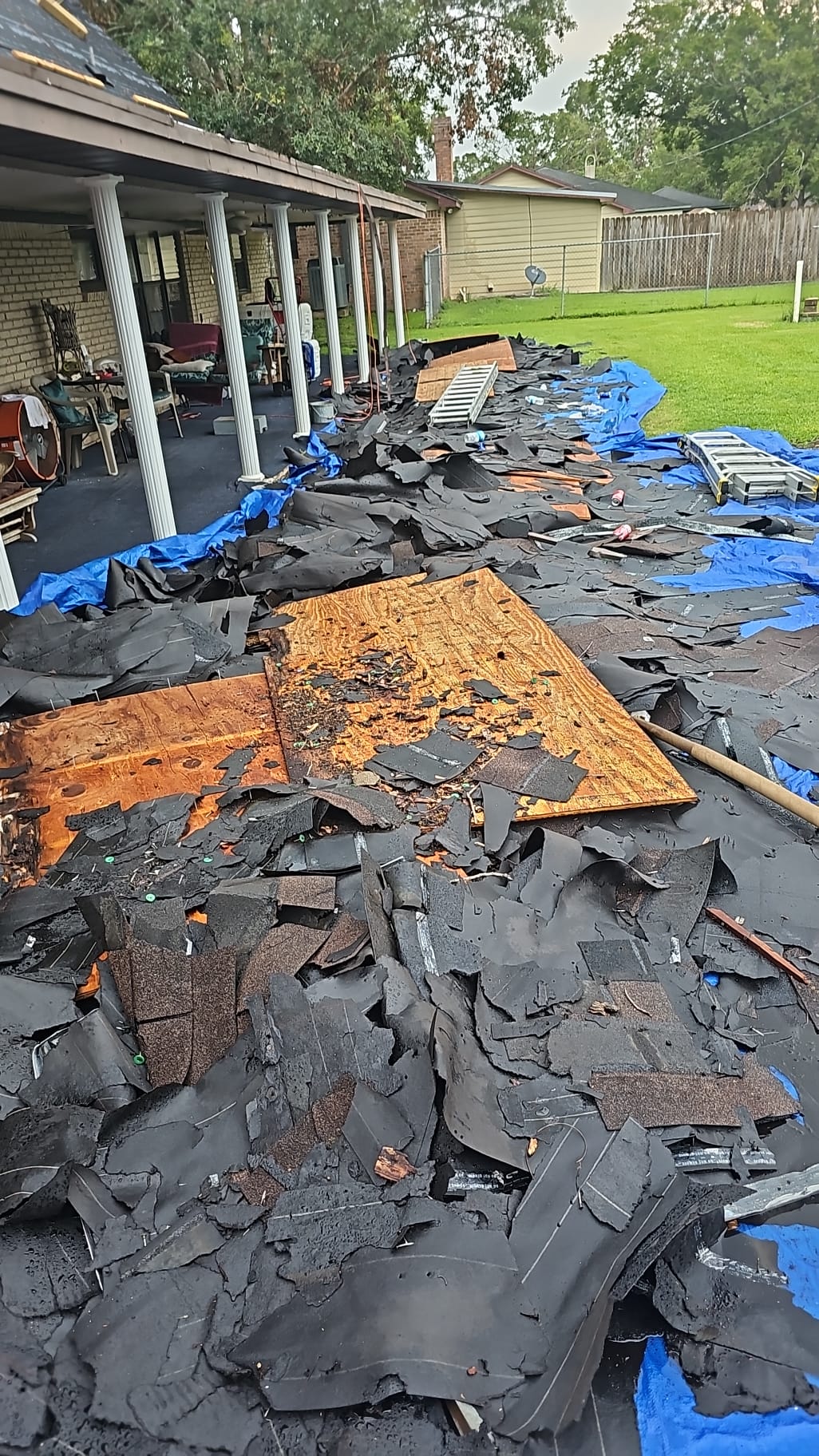 Charred debris scattered on the ground after a fire.