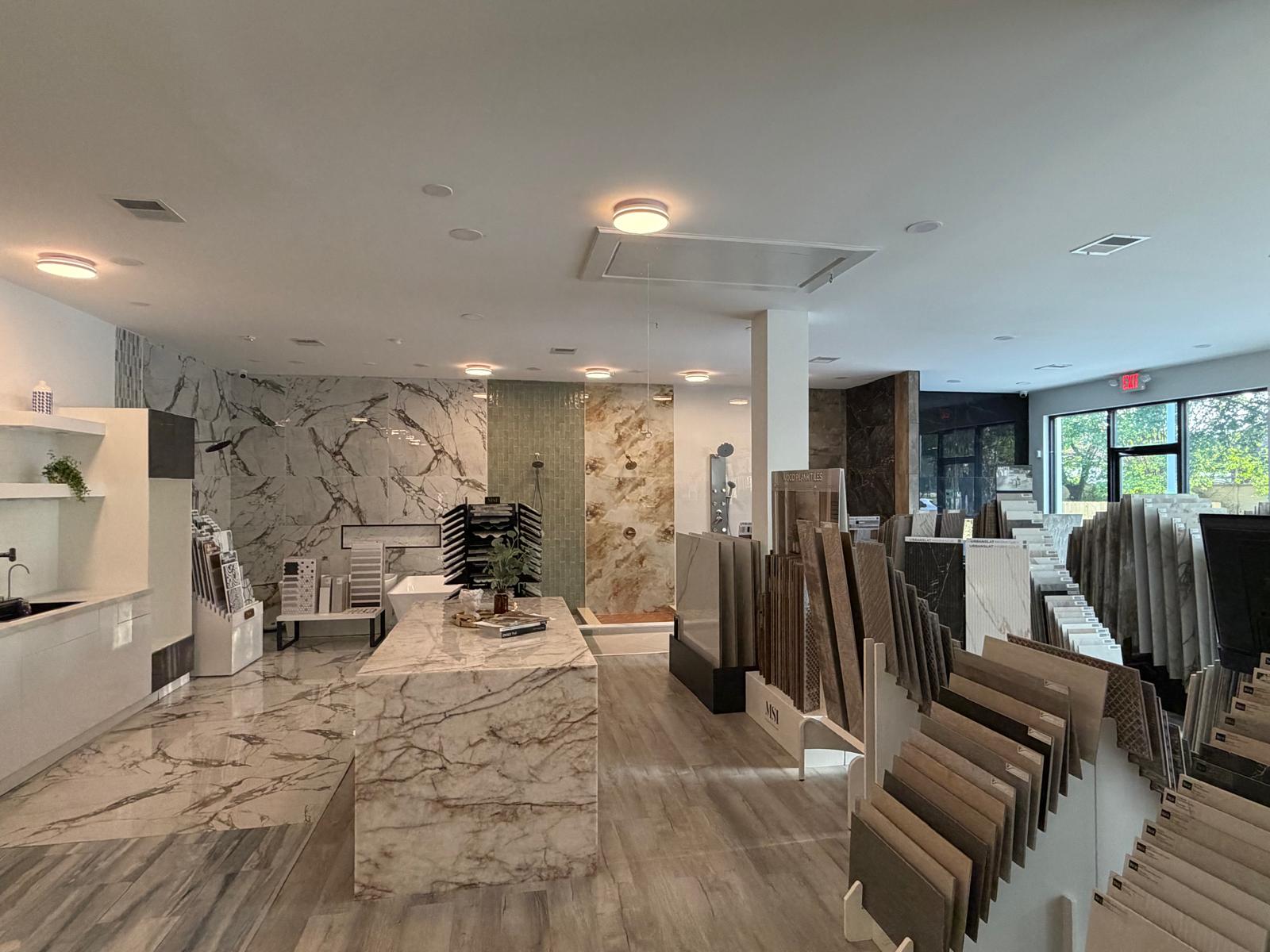 A spacious tile showroom with various tile samples displayed.